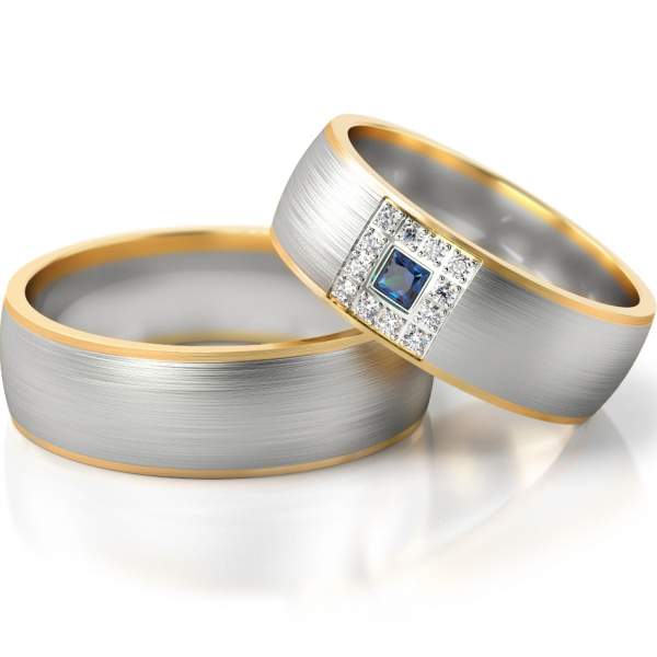 Trauringe Gelbgold-Weissgold (333) mit 12 Brillanten à 0,01ct. & 1 farbigem Princesscut-Diamant 0,04ct.