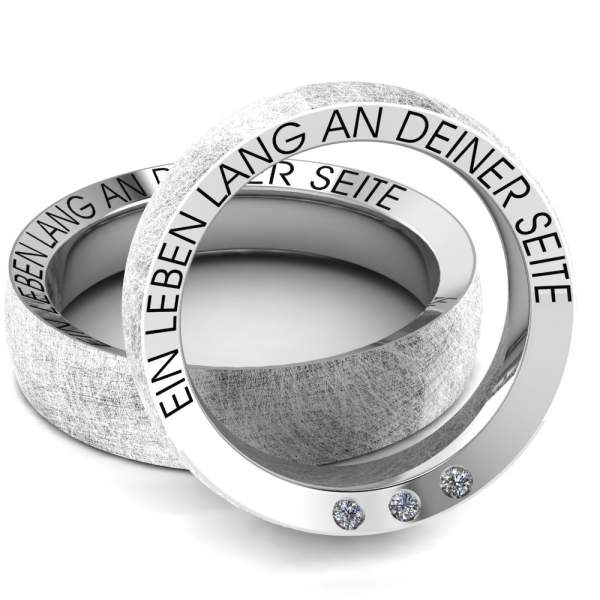 2 Silberringe mit seitlicher Gravur und 3 Steinen