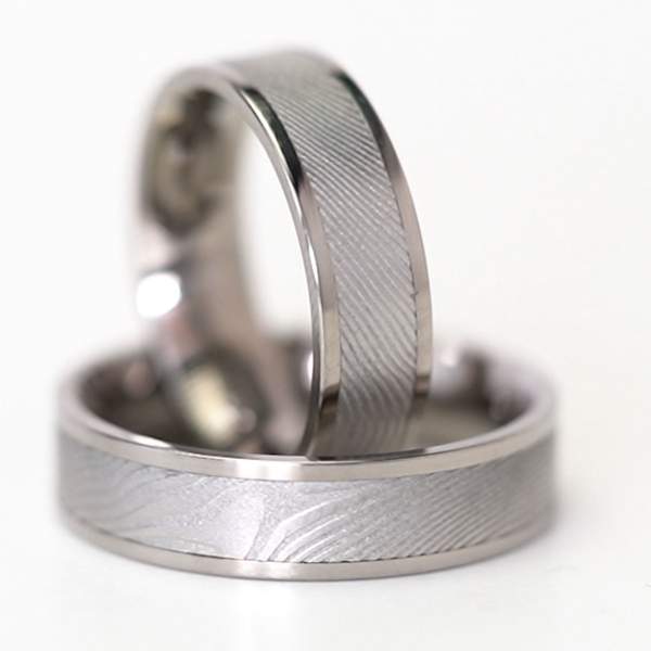Trauringe Titan mit Damast Stahl